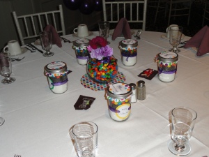 Adult tables with favors per couple and some M&M packets to enjoy