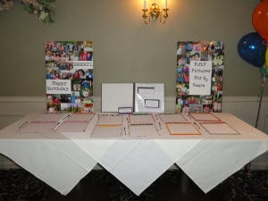 Guestbook table with a collage of pictures shaped like the number 50, with 50 pictures on it