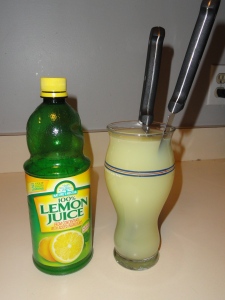 Knives submerged in lemon juice